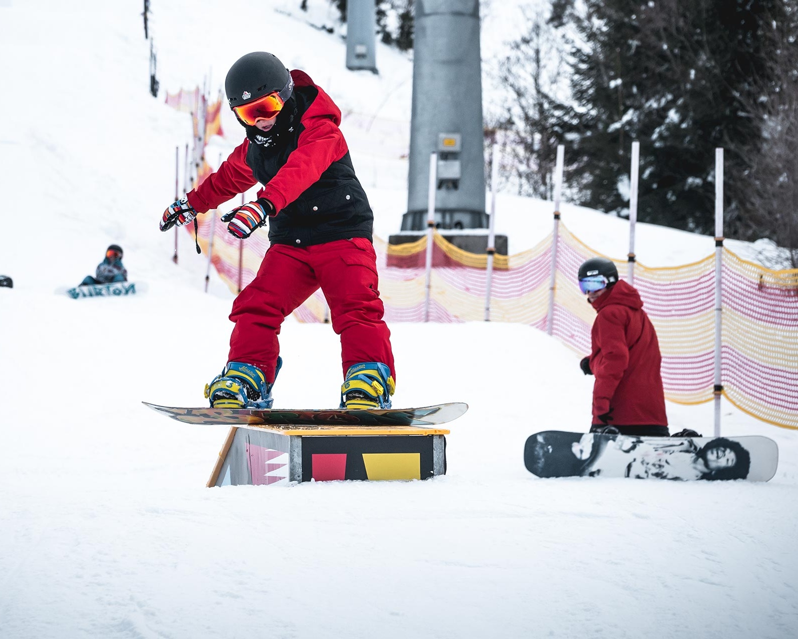 Snowboard kid slides on box